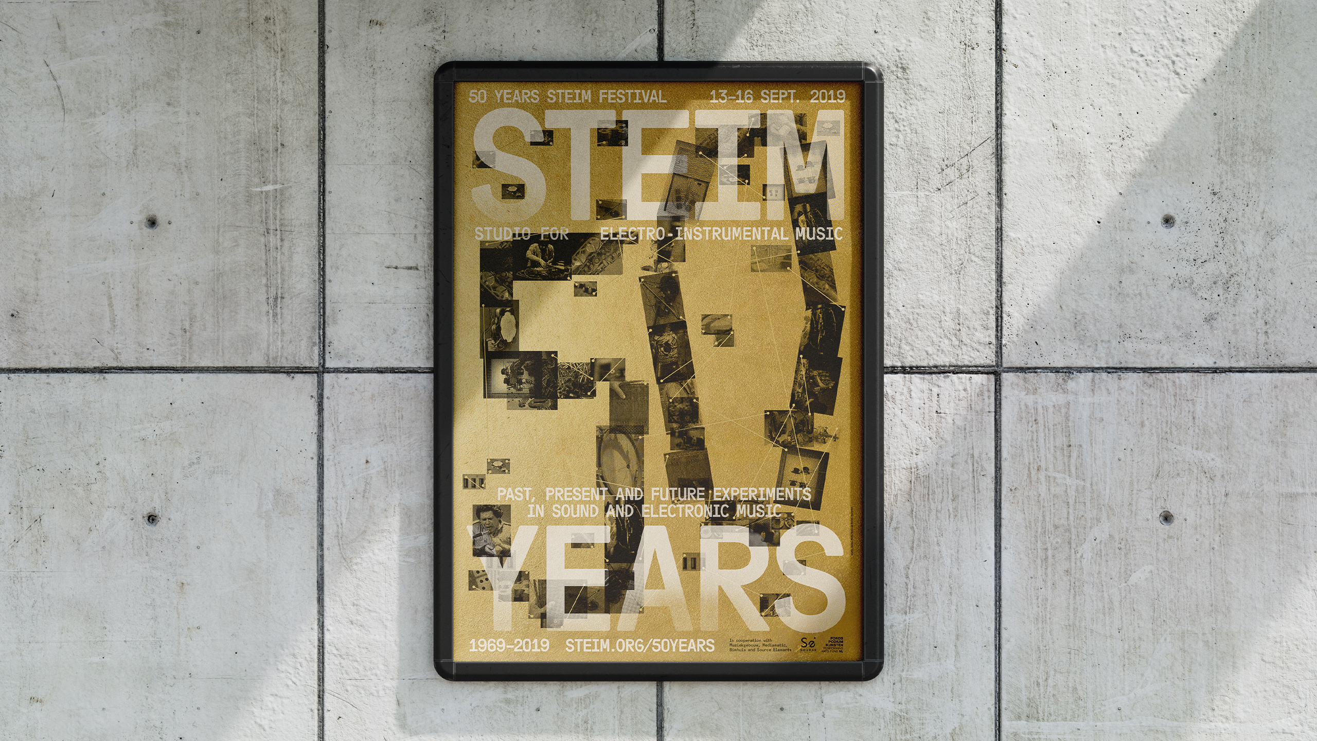 Framed STEIM 50 Years poster mounted on a concrete wall